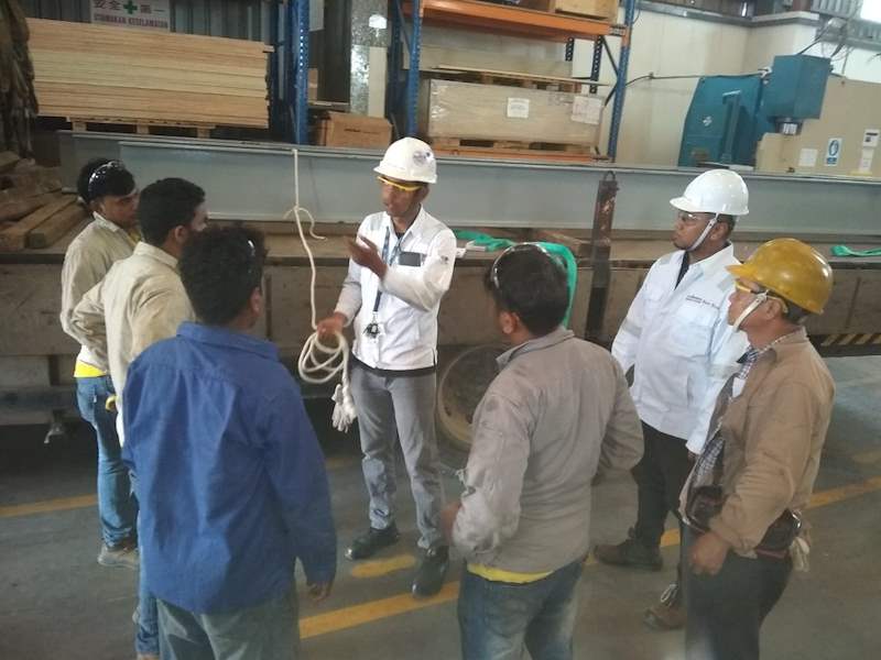 Site briefing - workers in safety helmets gathered inside the warehouse - Steel mezzanine platform in a factory (M22) | Wong Lye, BCA General Builder Class 2, Singapore