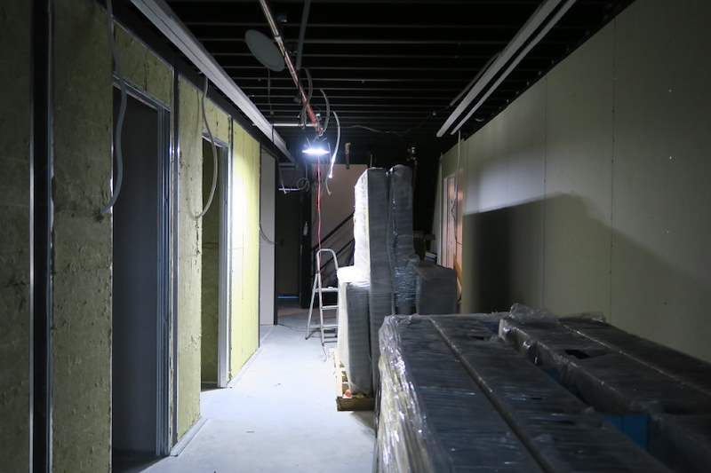 Corridor lined with insulated partitions, materials on the floor - Music rehearsal studio fit-out with a faceted timber ceiling (Studio) | Wong Lye, BCA General Builder Class 2, Singapore
