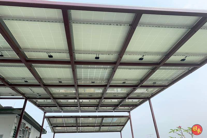 Solar panels held in the steel canopy frame, seen from below - Rooftop steel canopy carrying solar panels (M28) | Wong Lye, BCA General Builder Class 2, Singapore