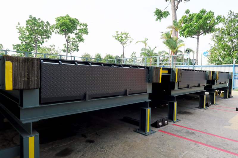 Steel loading platforms with checker-plate tops outside the shed - Heavy-duty cable drum racking in a cable yard (TSE) | Wong Lye, BCA General Builder Class 2, Singapore
