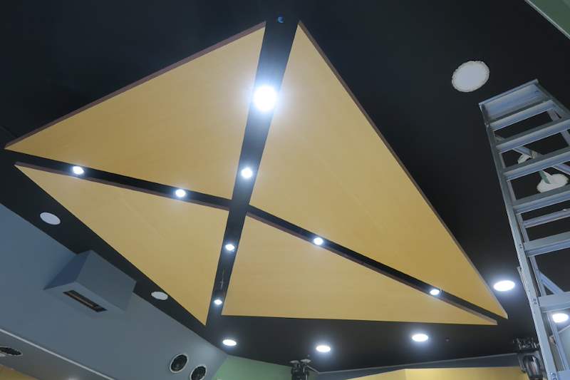 Detail of the faceted timber ceiling panels with downlights - Music rehearsal studio fit-out with a faceted timber ceiling (Studio) | Wong Lye, BCA General Builder Class 2, Singapore