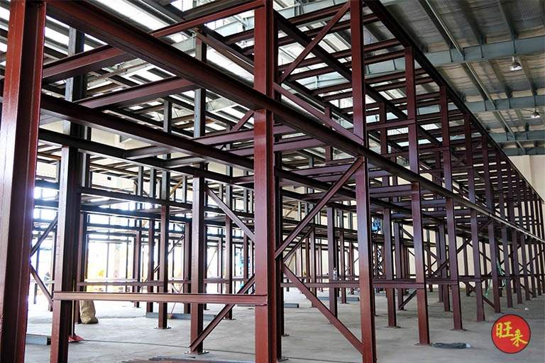 Multi-bay red-oxide primed steel racking structure before the drums were loaded - Heavy-duty cable drum racking in a cable yard (TSE) | Wong Lye, BCA General Builder Class 2, Singapore