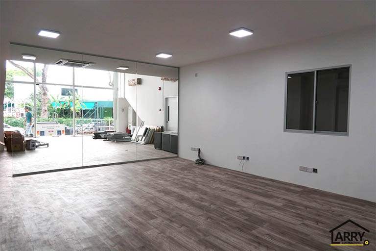 Office room with a glass partition to the front and a window to the side - Framed glass frontage and steel entrance stair for an industrial unit (M09) | Wong Lye, BCA General Builder Class 2, Singapore