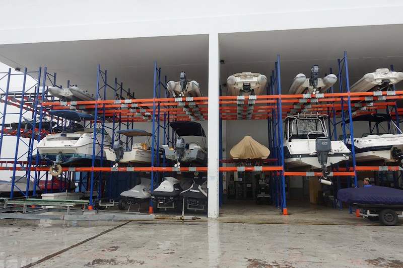 Row of two-tier boat racks seen from the apron, boats stored on the upper beams - Heavy-duty racking for boats and jet skis (Sentosa) | Wong Lye, BCA General Builder Class 2, Singapore
