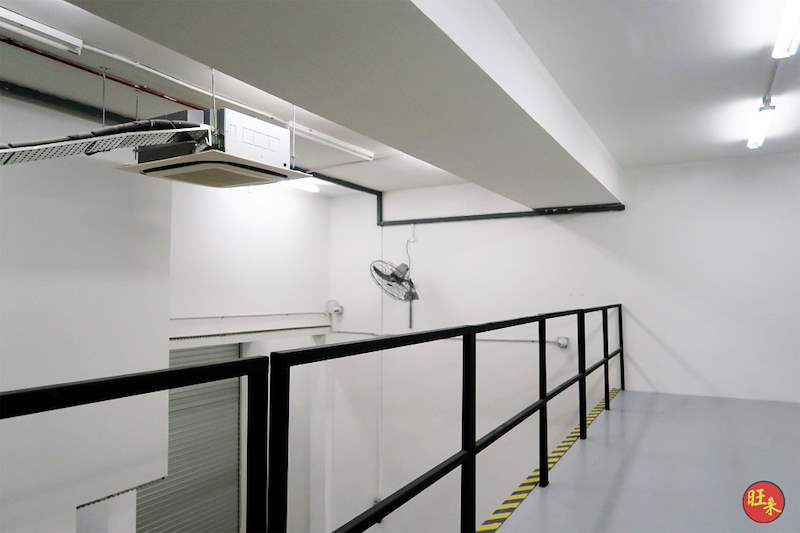Mezzanine deck edge with the mesh balustrade, wall fan and cassette air-conditioning unit - Steel mezzanine floor with staircase in a factory unit (OverseaFactory) | Wong Lye, BCA General Builder Class 2, Singapore