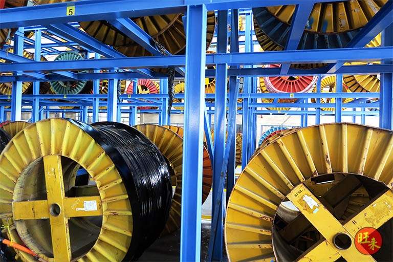 Drum rack with cable drums seated on the beams, close view - Heavy-duty cable drum racking in a cable yard (TSE) | Wong Lye, BCA General Builder Class 2, Singapore