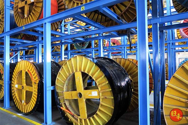 Cable drums on the racking, seen from the aisle - Heavy-duty cable drum racking in a cable yard (TSE) | Wong Lye, BCA General Builder Class 2, Singapore