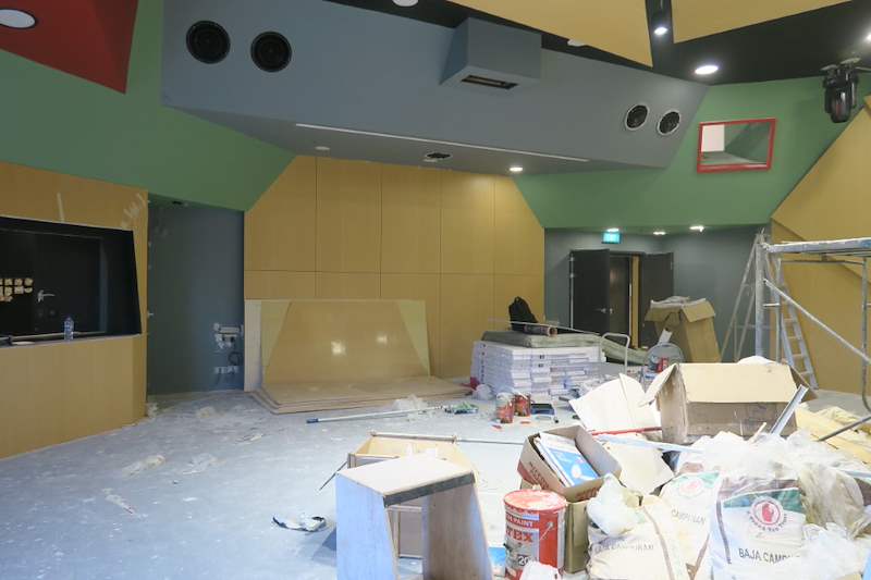 Room with timber panels, a scaffold and materials during fit-out - Music rehearsal studio fit-out with a faceted timber ceiling (Studio) | Wong Lye, BCA General Builder Class 2, Singapore