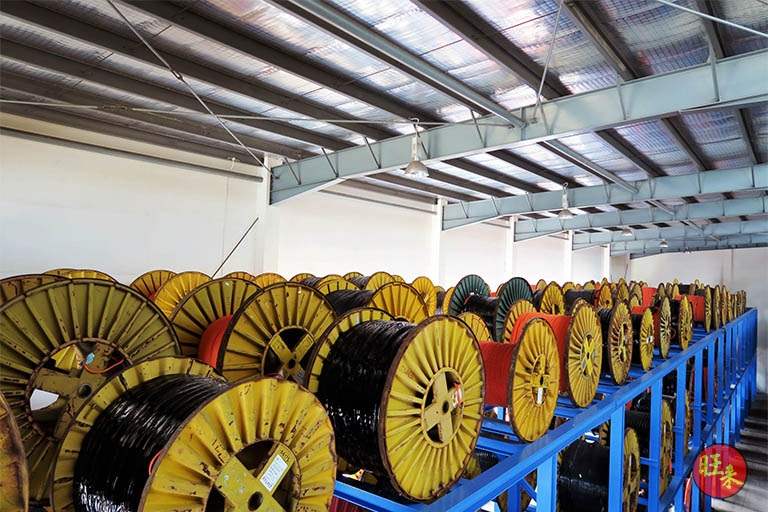 Rows of cable drums on the ground tier under the shed roof - Heavy-duty cable drum racking in a cable yard (TSE) | Wong Lye, BCA General Builder Class 2, Singapore