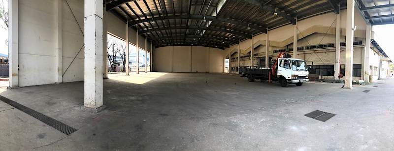 Before: the empty covered shed with a lorry parked inside - Heavy-duty cable drum racking in a cable yard (TSE) | Wong Lye, BCA General Builder Class 2, Singapore