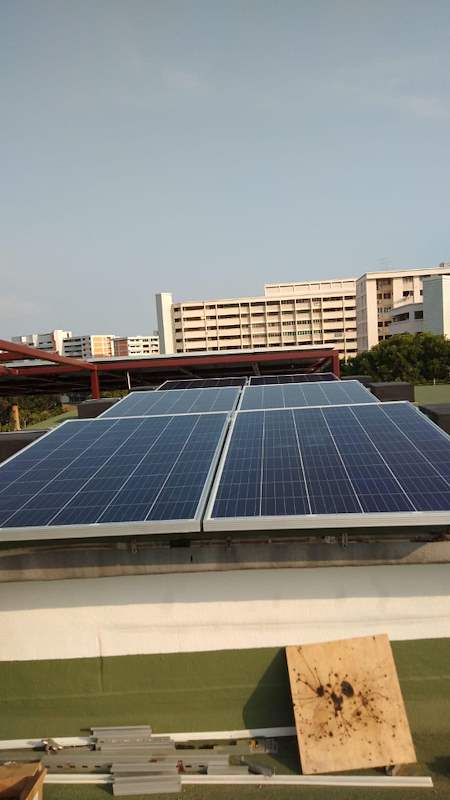 Solar panels on the roof with a timber board in the foreground - Rooftop steel canopy carrying solar panels (M28) | Wong Lye, BCA General Builder Class 2, Singapore