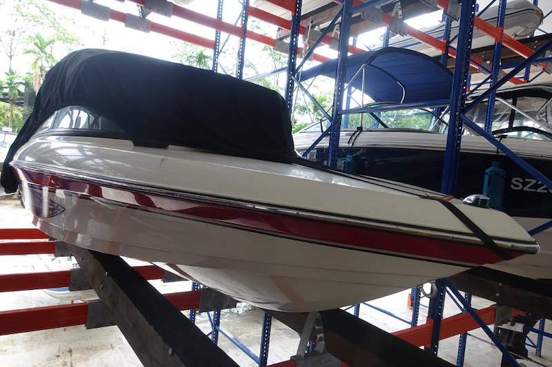 Boat hull resting on timber bunks mounted on the orange racking beams - Heavy-duty racking for boats and jet skis (Sentosa) | Wong Lye, BCA General Builder Class 2, Singapore