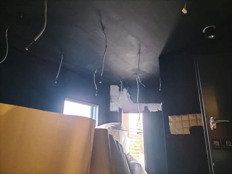 Black-painted ceiling with cables dropped for the speakers, curved timber panel taking shape - Music rehearsal studio fit-out with a faceted timber ceiling (Studio) | Wong Lye, BCA General Builder Class 2, Singapore