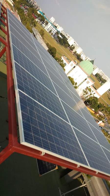 Panel array on a red steel frame at the edge of the roof - Rooftop steel canopy carrying solar panels (M28) | Wong Lye, BCA General Builder Class 2, Singapore