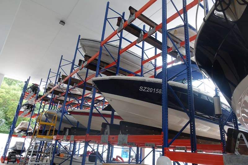 Boats on the upper tiers of the racking, looking up from the aisle - Heavy-duty racking for boats and jet skis (Sentosa) | Wong Lye, BCA General Builder Class 2, Singapore