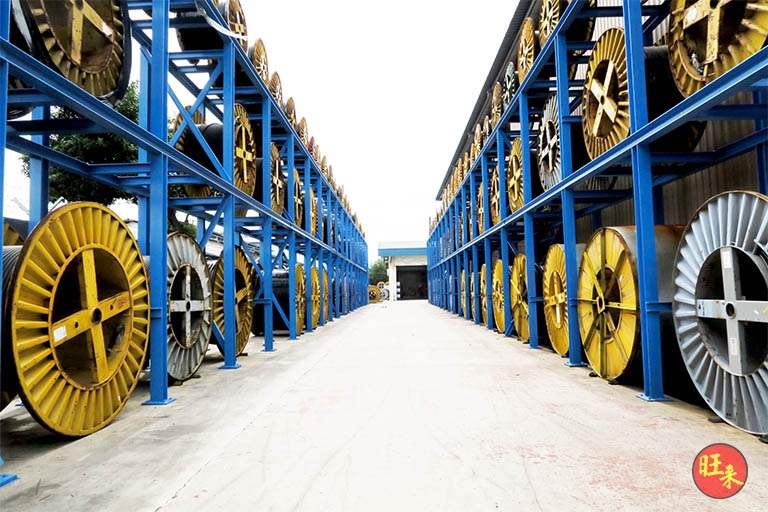 After: aisle between the drum racks in the open yard, drums on both sides - Heavy-duty cable drum racking in a cable yard (TSE) | Wong Lye, BCA General Builder Class 2, Singapore