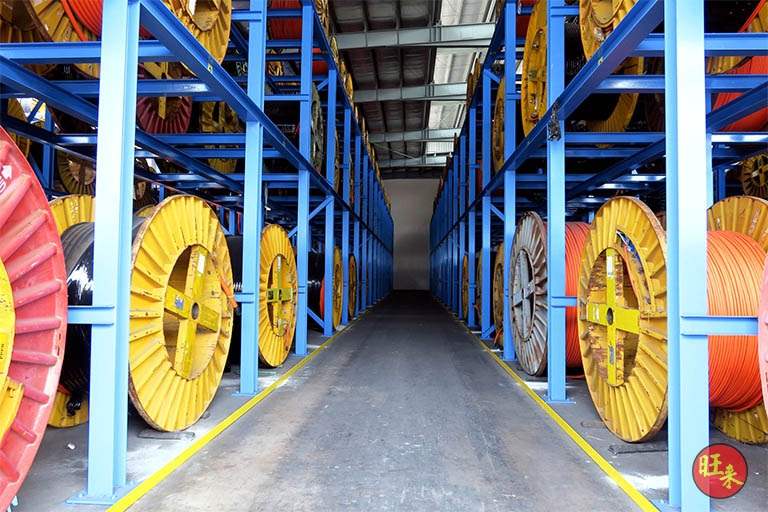 Aisle between two loaded drum racks - Heavy-duty cable drum racking in a cable yard (TSE) | Wong Lye, BCA General Builder Class 2, Singapore