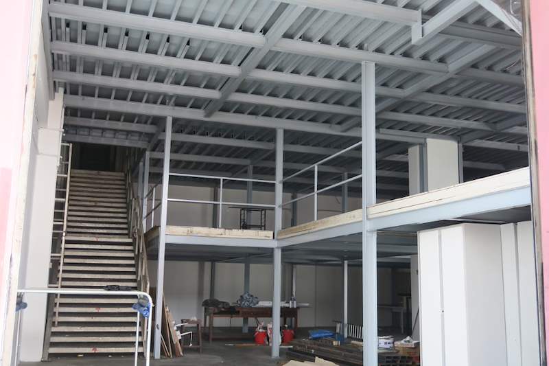 Two-level steel mezzanine structure with staircases and railings inside the building - Two-level steel mezzanine with staircases (HF0107) | Wong Lye, BCA General Builder Class 2, Singapore