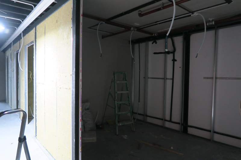 Construction: an insulated stud partition with a ladder alongside - Music rehearsal studio fit-out with a faceted timber ceiling (Studio) | Wong Lye, BCA General Builder Class 2, Singapore