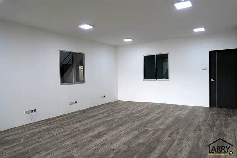 Office room with white walls, timber-look floor and internal window panels - Framed glass frontage and steel entrance stair for an industrial unit (M09) | Wong Lye, BCA General Builder Class 2, Singapore