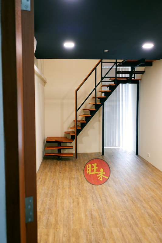View from the doorway of the staircase and loft over the timber-look floor - Office loft with a cantilevered steel and timber staircase (HomeOffice) | Wong Lye, BCA General Builder Class 2, Singapore