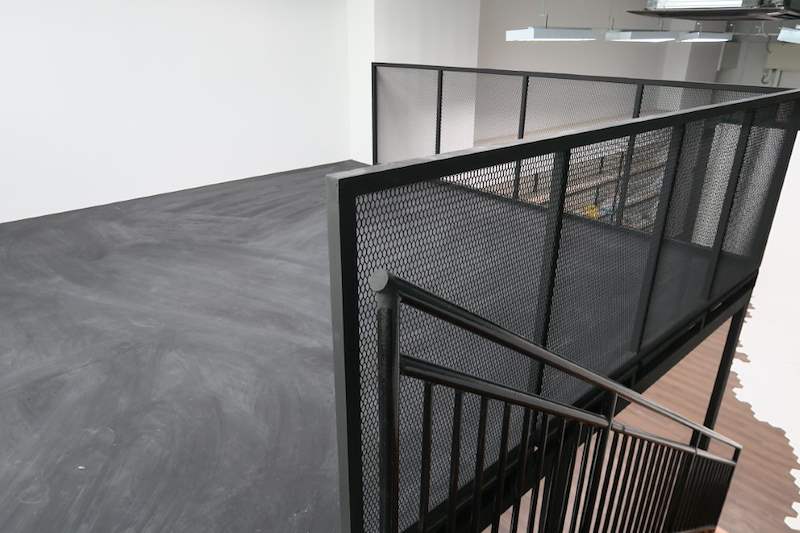 Loft edge with mesh balustrade panels and the stair handrail - Steel loft platform with staircase in an industrial unit (Loft) | Wong Lye, BCA General Builder Class 2, Singapore
