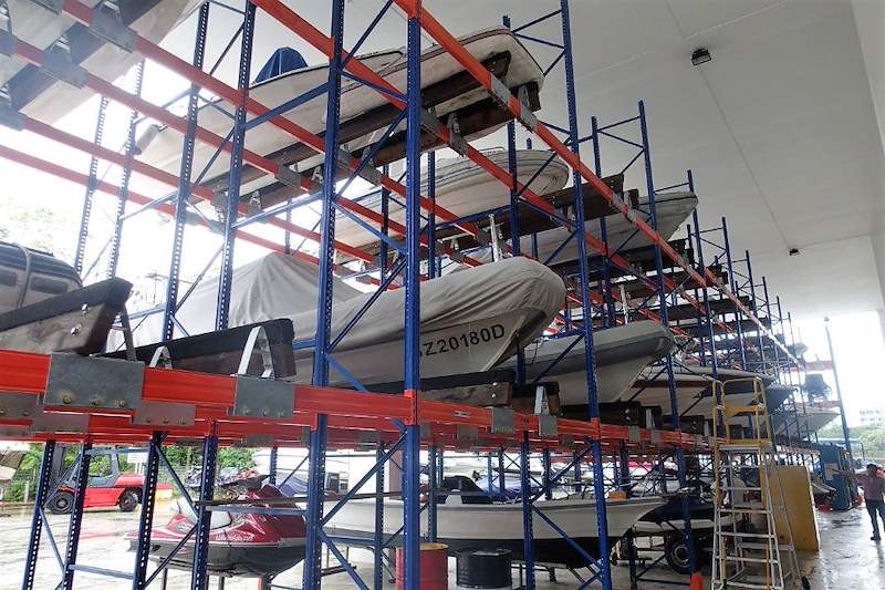 Tall racking with boats stacked three tiers high and a ladder alongside - Heavy-duty racking for boats and jet skis (Sentosa) | Wong Lye, BCA General Builder Class 2, Singapore
