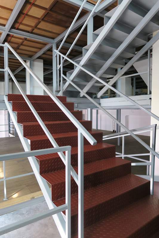 Staircase with red checker-plate treads and grey railings - Two-level steel mezzanine with staircases (HF0107) | Wong Lye, BCA General Builder Class 2, Singapore
