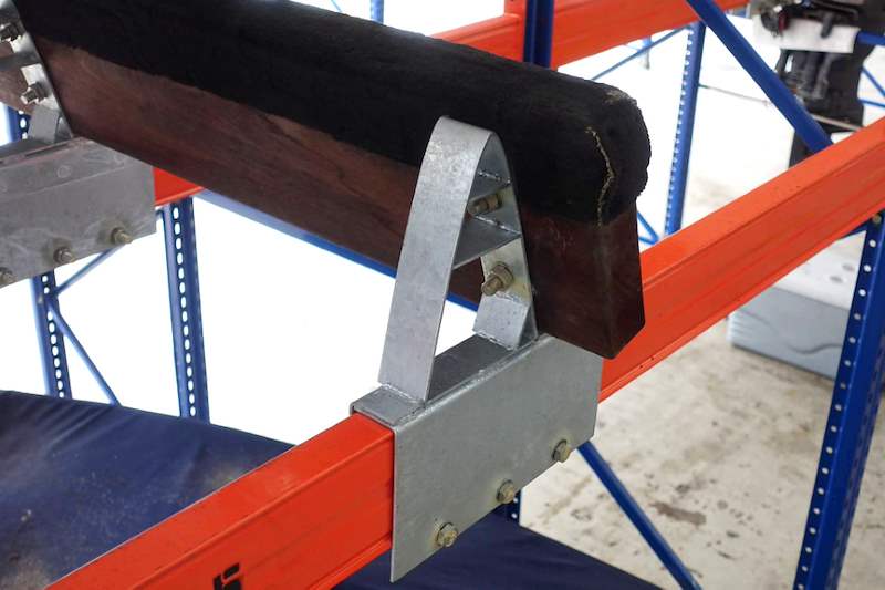 Galvanised bunk bracket bolted to an orange beam, with the timber bunk fixed on top - Heavy-duty racking for boats and jet skis (Sentosa) | Wong Lye, BCA General Builder Class 2, Singapore