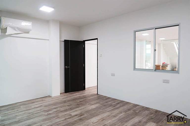 Room with a black door and an internal window - Framed glass frontage and steel entrance stair for an industrial unit (M09) | Wong Lye, BCA General Builder Class 2, Singapore